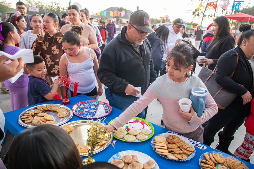 Students line up to get holiday cookies