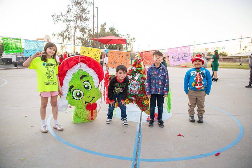 Students on the basketball court showing off their holiday attire