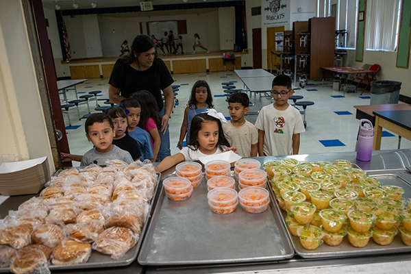 Students line up in the cafeteria to get their lunch